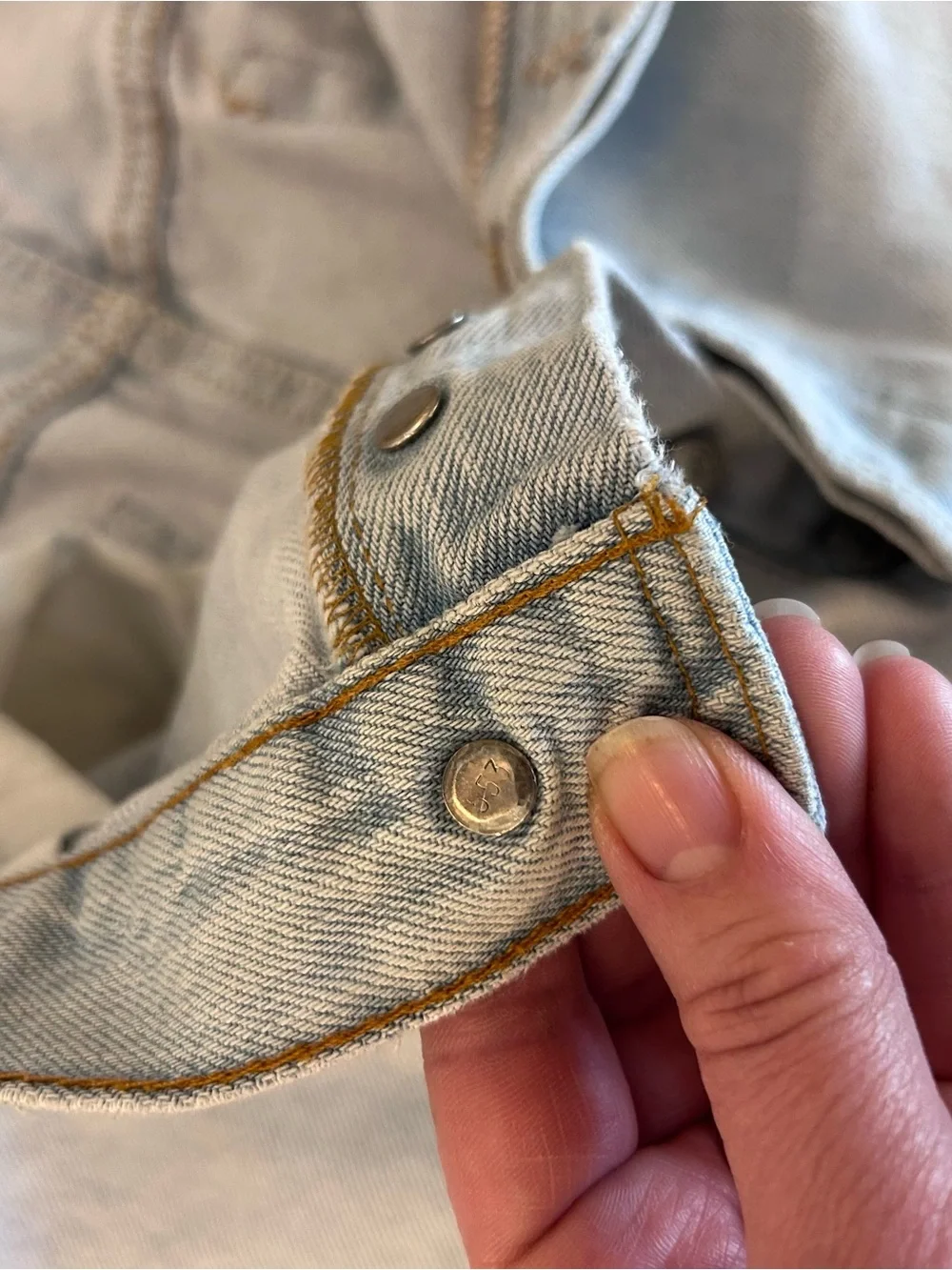 Vintage 1993 men's Levi's 501 light blue denim jeans with leather patch 38×34